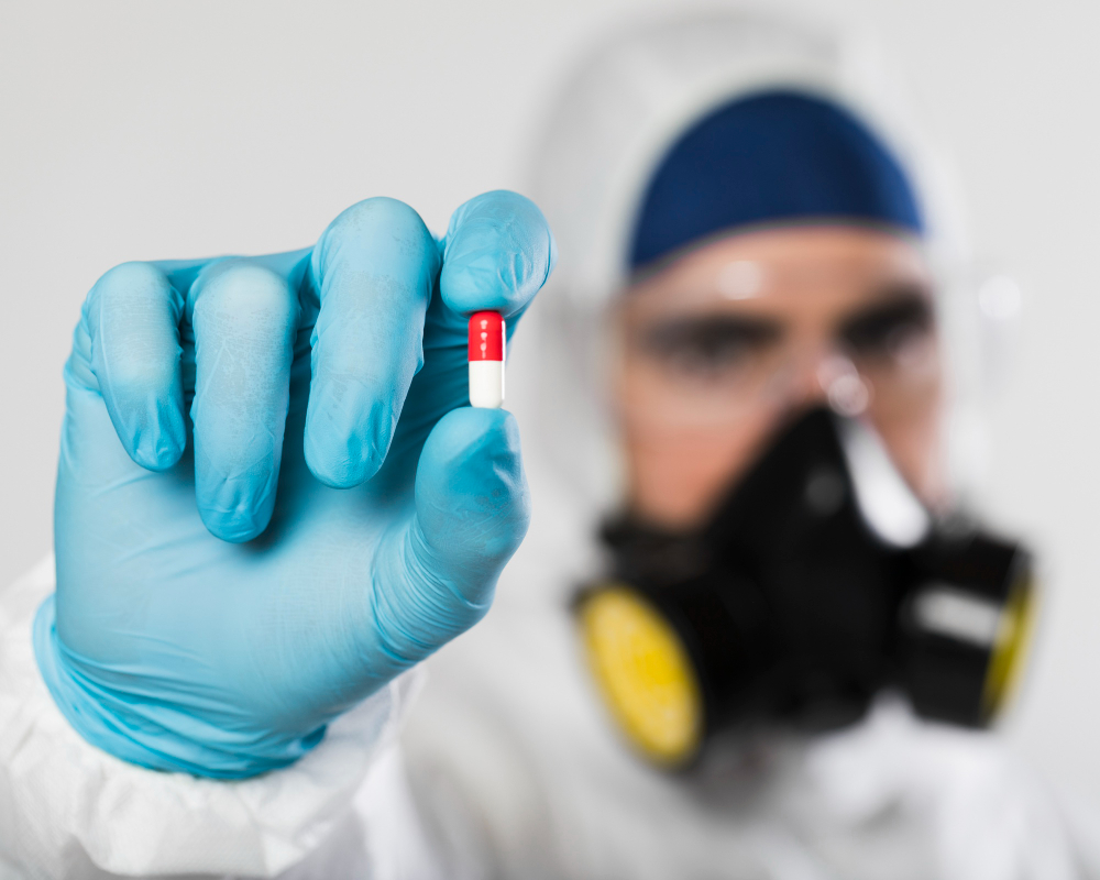 Close-up adult male holding medical capsule