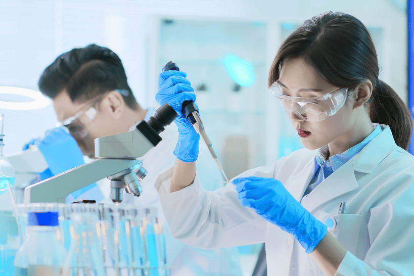 Lab professional performing process control testing in biopharma setup