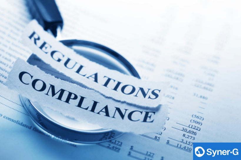 Team reviewing compliance documents and regulatory checklist in an office setting