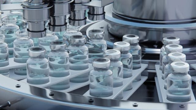 Biopharmaceutical vials on an automated manufacturing line in a pharmaceutical production facility
