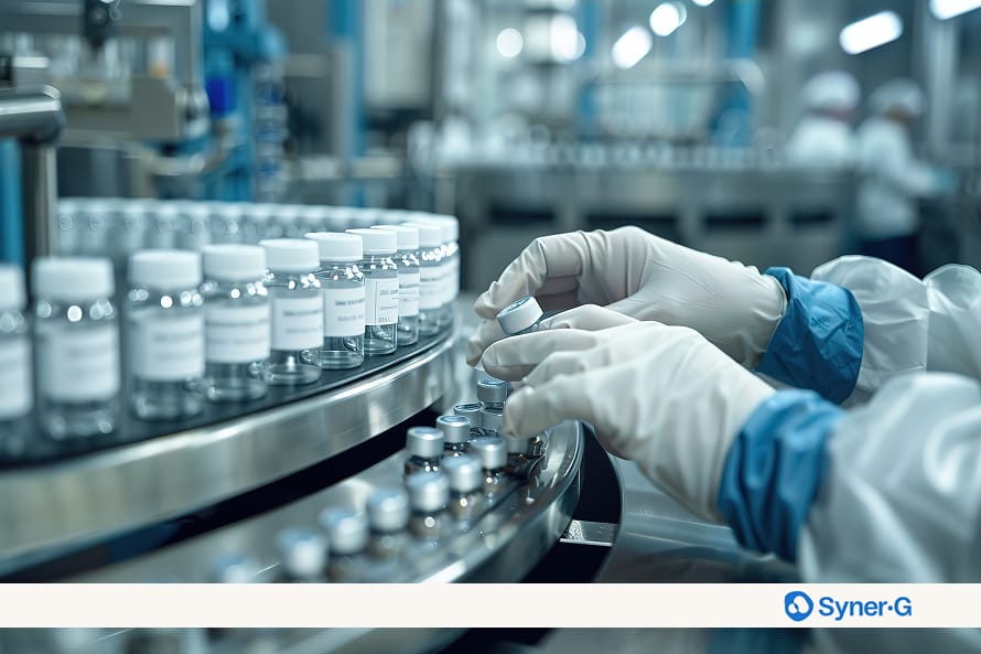 Gloved technician placing labeled pharma vials on an automated line inside a GMP stability storage cleanroom used for pharmaceutical products.