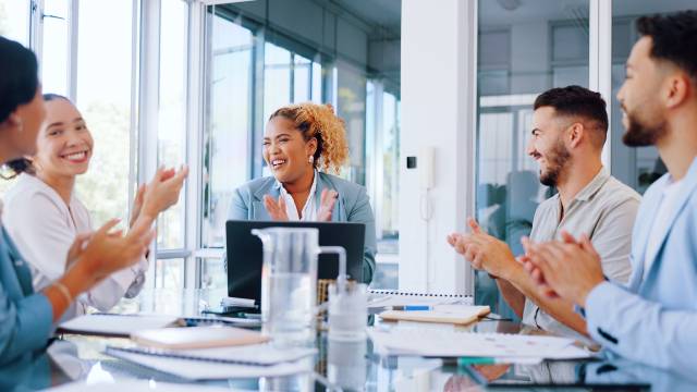 Biopharma leadership team celebrating a successful milestone in drug development