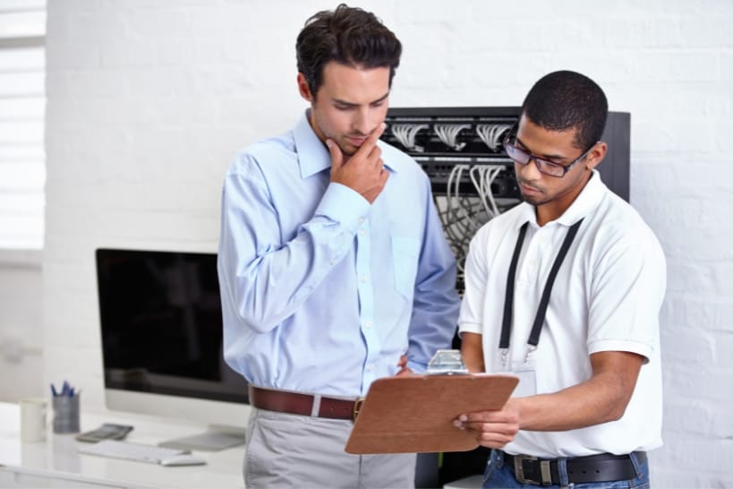 Biopharma professionals reviewing documents for potential red flags during CDMO selection.